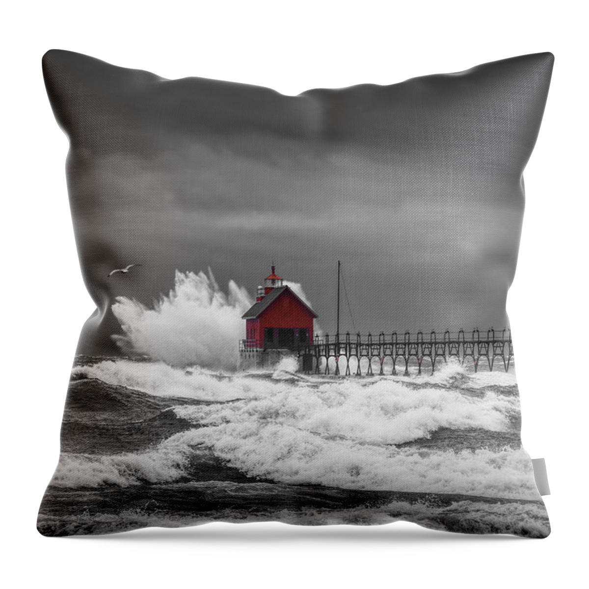 Lighthouse Throw Pillow featuring the photograph November Storm with Flying Gull by the Grand Haven Lighthouse by Randall Nyhof