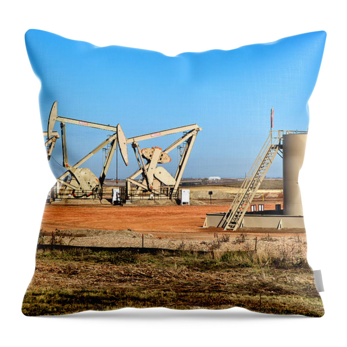 Nodding Donkey Throw Pillow featuring the photograph Oil Well Pumps And Storage Tanks by Inga Spence