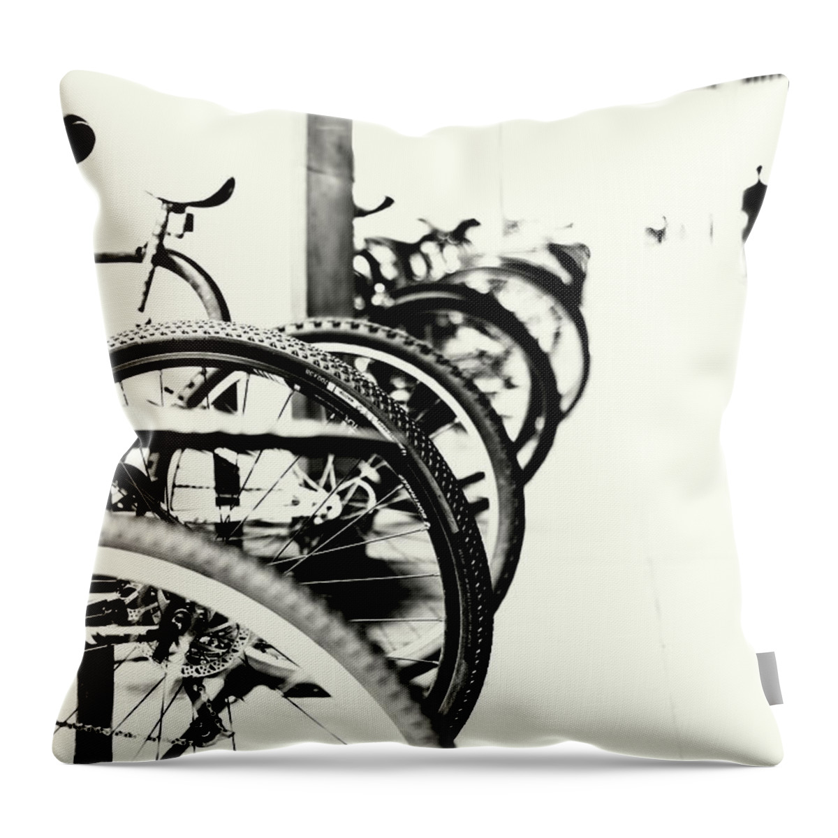 Commuter Bikes Throw Pillow featuring the photograph Passing Cycles by John Williams