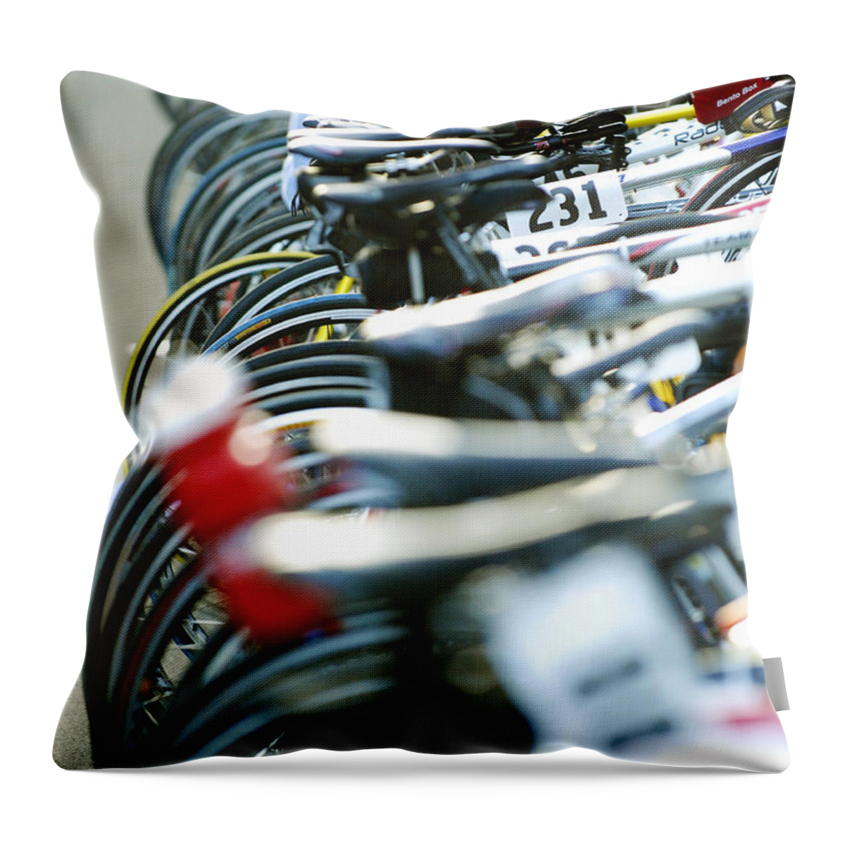 Row Throw Pillow featuring the photograph Row of race bikes 4 by Micah May
