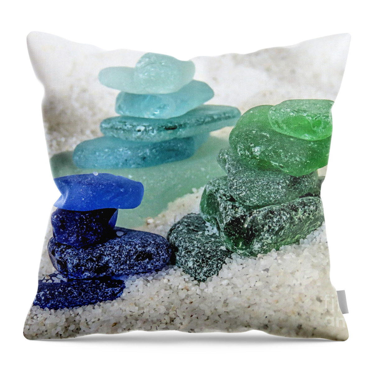 Sea Glass Throw Pillow featuring the photograph Sea glass Stacks by Janice Drew
