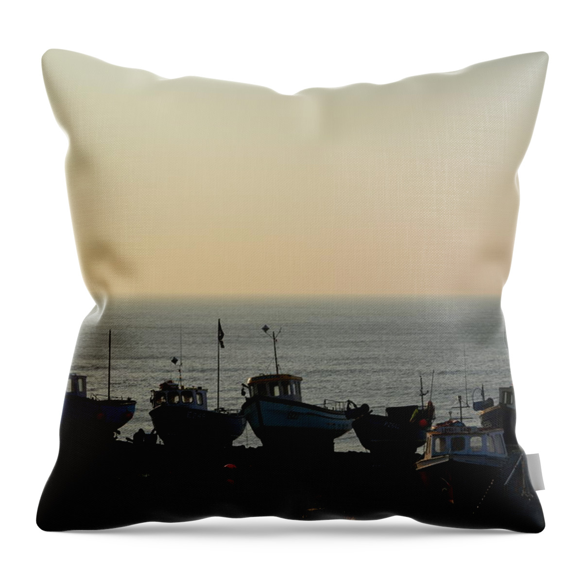 Silhouette Throw Pillow featuring the photograph Silhouette of boats on beach by Andy Thompson