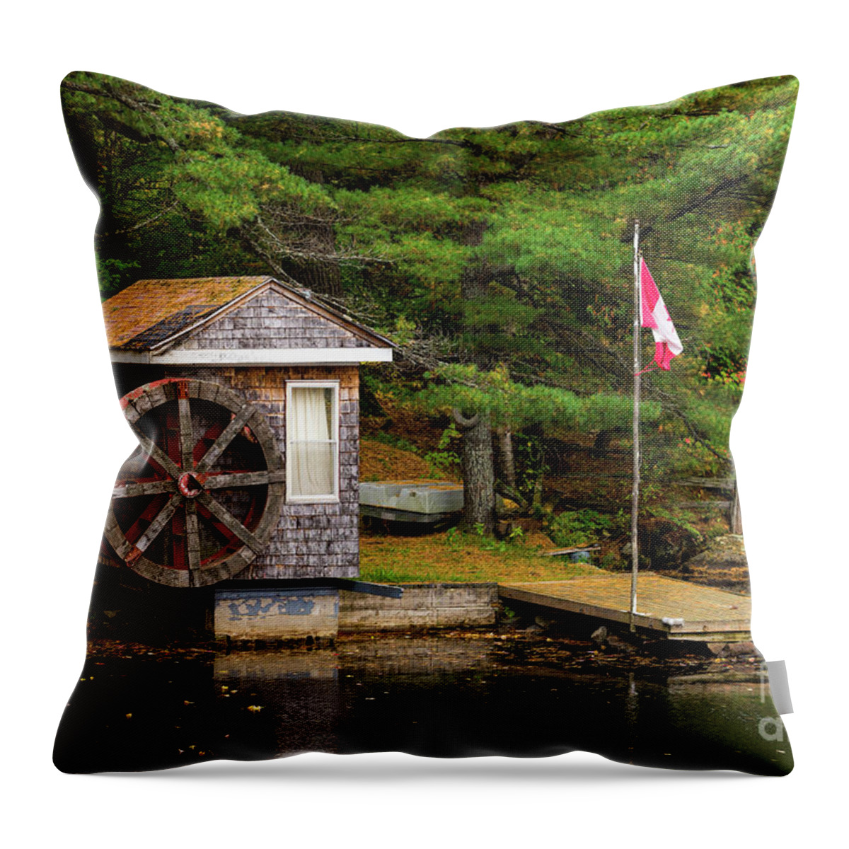 Colors Throw Pillow featuring the photograph Small shed with a large wooden wheel by Les Palenik