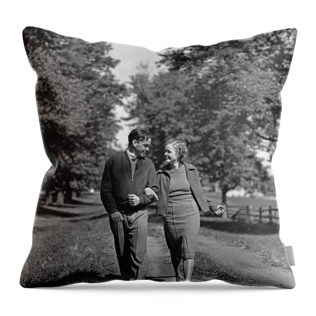 1930s Throw Pillow featuring the photograph Teen Couple Out For A Walk, C.1930-40s by H. Armstrong Roberts/ClassicStock