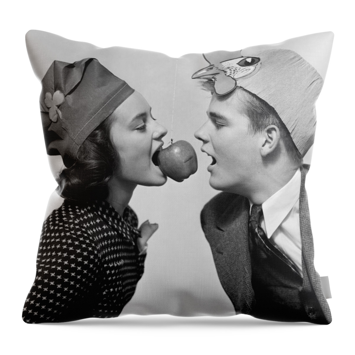 1940s Throw Pillow featuring the photograph Teen Girl And Boy Bobbing For Apple by H. Armstrong Roberts/ClassicStock