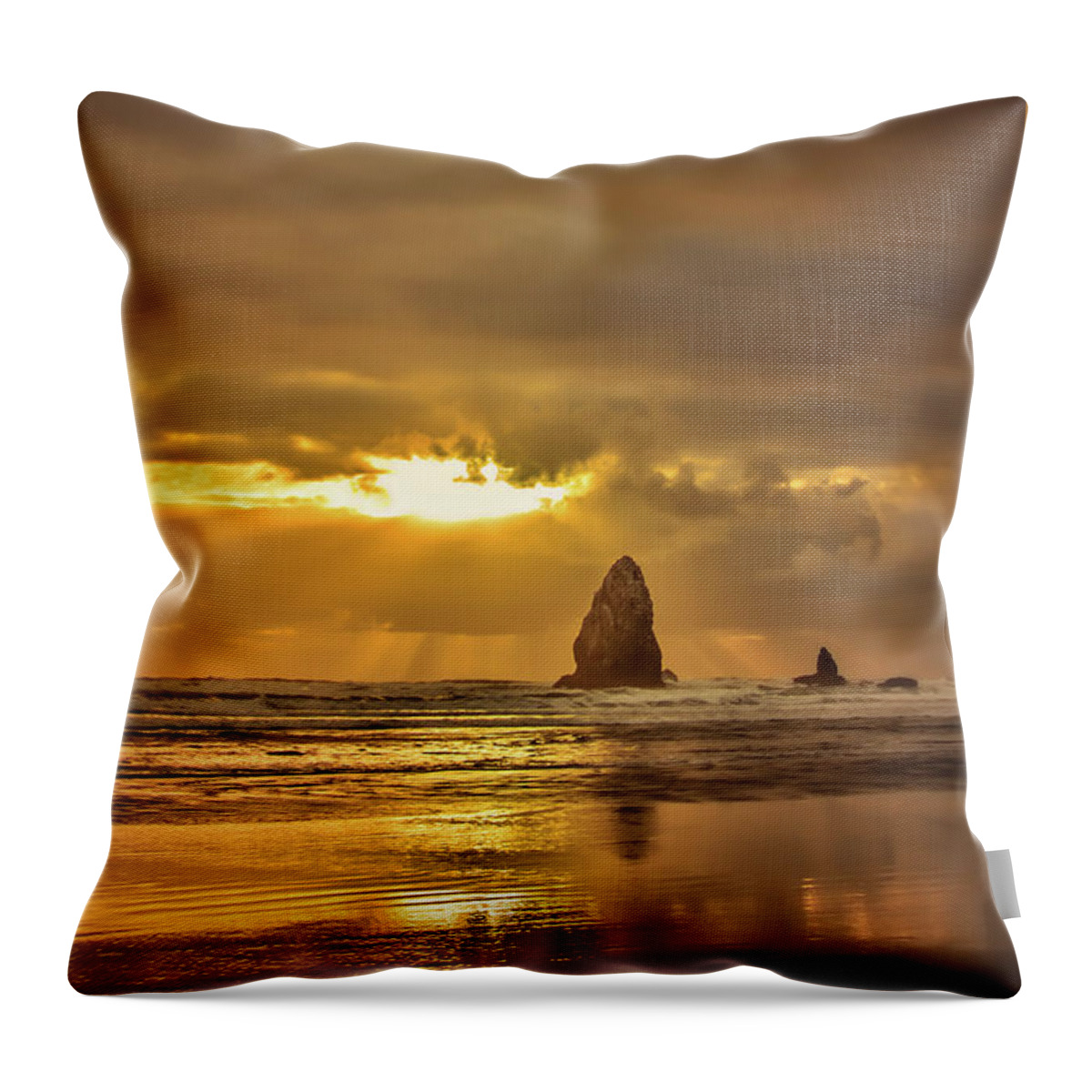 Cannon Beach Throw Pillow featuring the photograph The Evening Glow by Don Schwartz