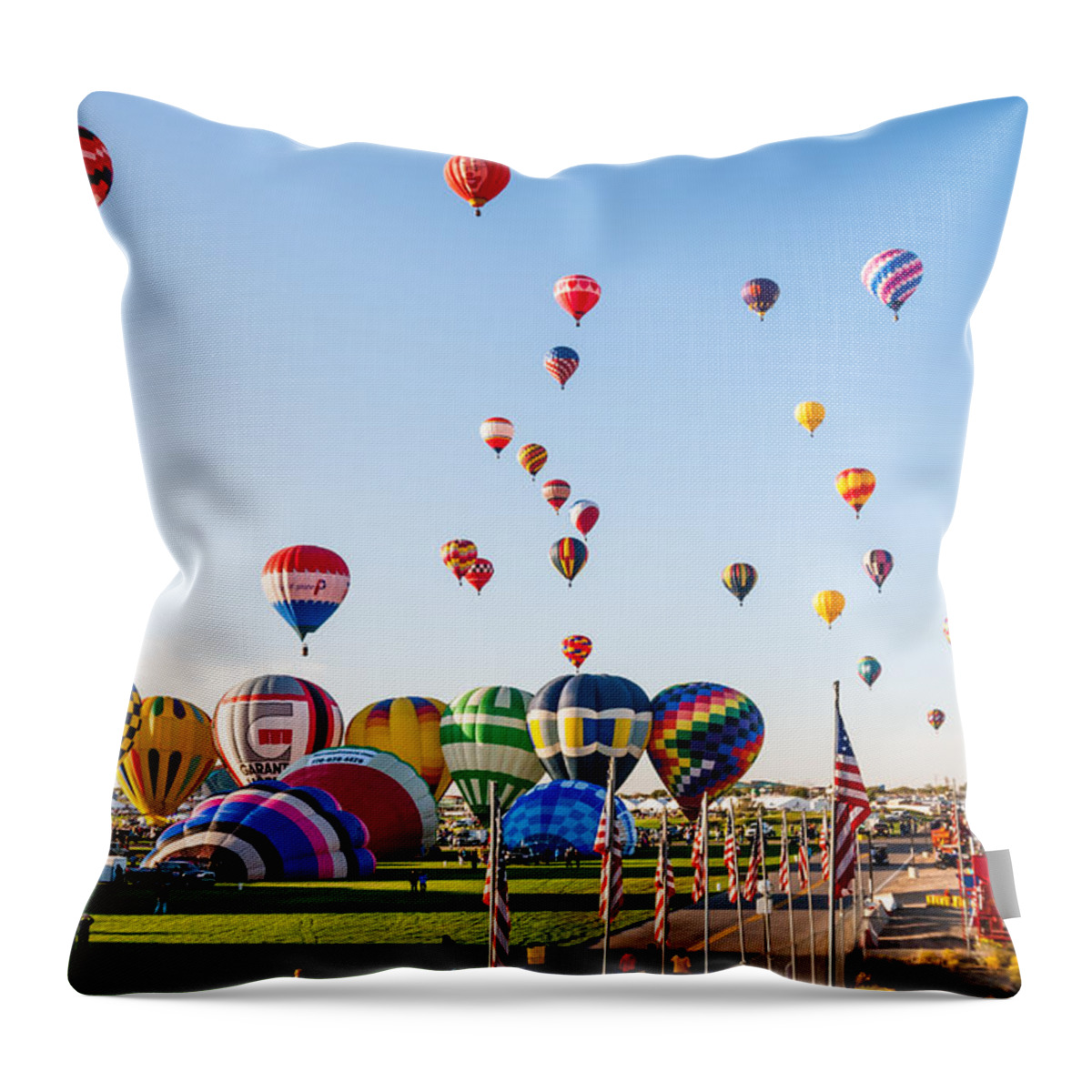 Hot Air Balloons Throw Pillow featuring the photograph They all go by Charles McCleanon