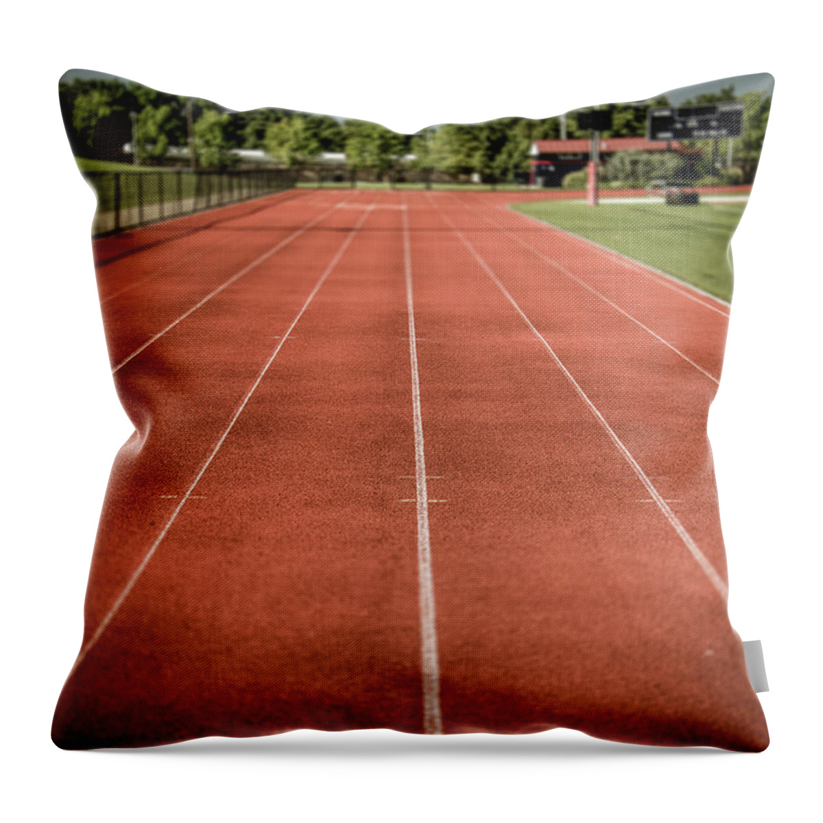 This Is A Photo I Took At My High School In Plymouth Whitemarsh Pennsylvania . Plymouth Whitemarsh High School Track And Field With Some Added Depth Of Field With A Process Called Tilt-shift Giving The Effect Of Depth. Throw Pillow featuring the photograph Track and Field Of Depth One by Howard Roberts