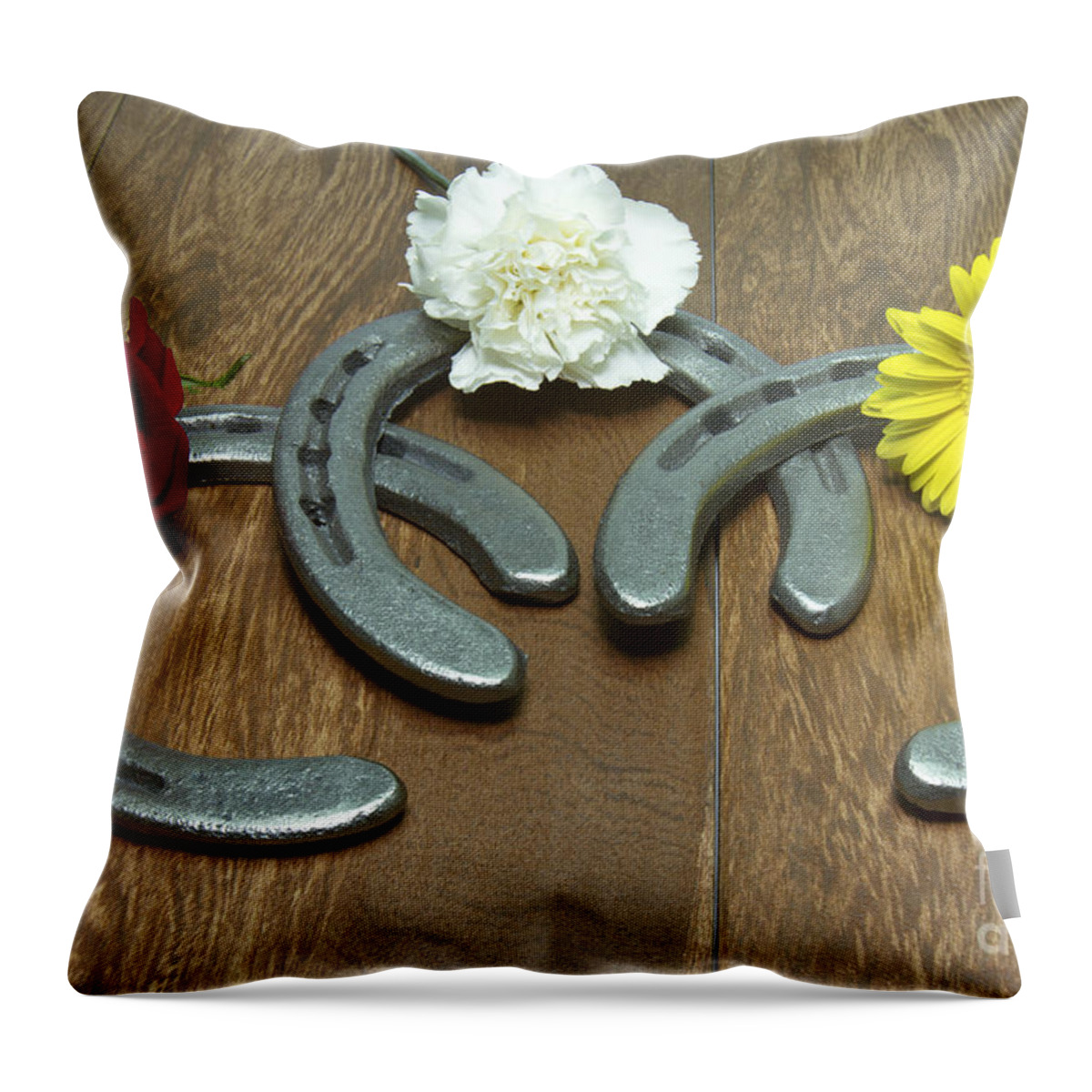 Triple Crown Throw Pillow featuring the photograph Triple Crown Flowers on Horseshoes by Karen Foley