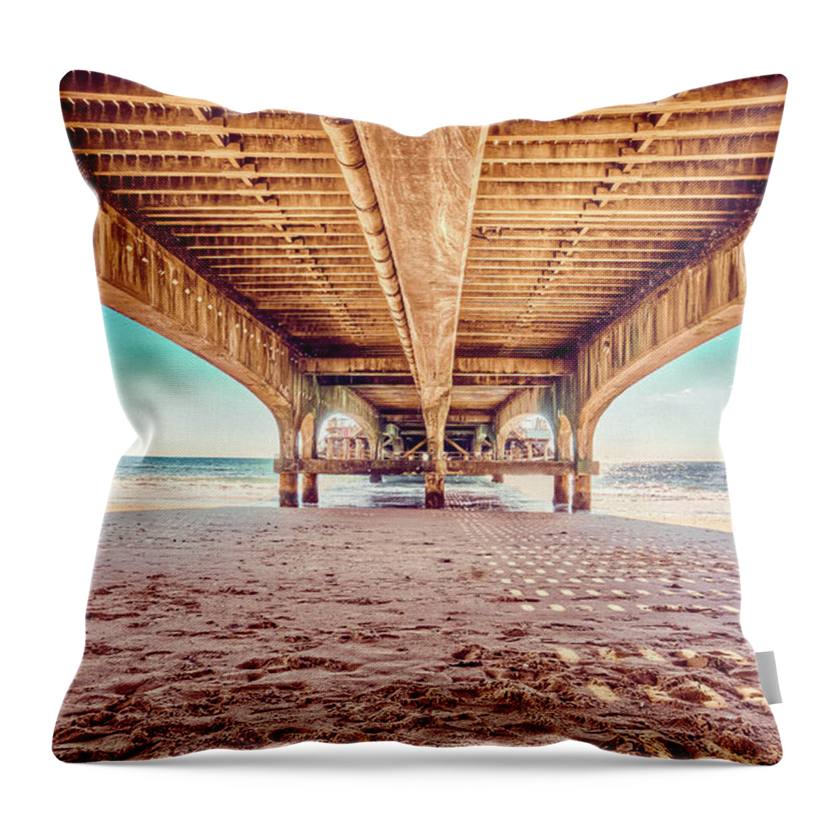 Beach Throw Pillow featuring the photograph Under The Wooden Piear On A Sand Beach Art by Wall Art Prints