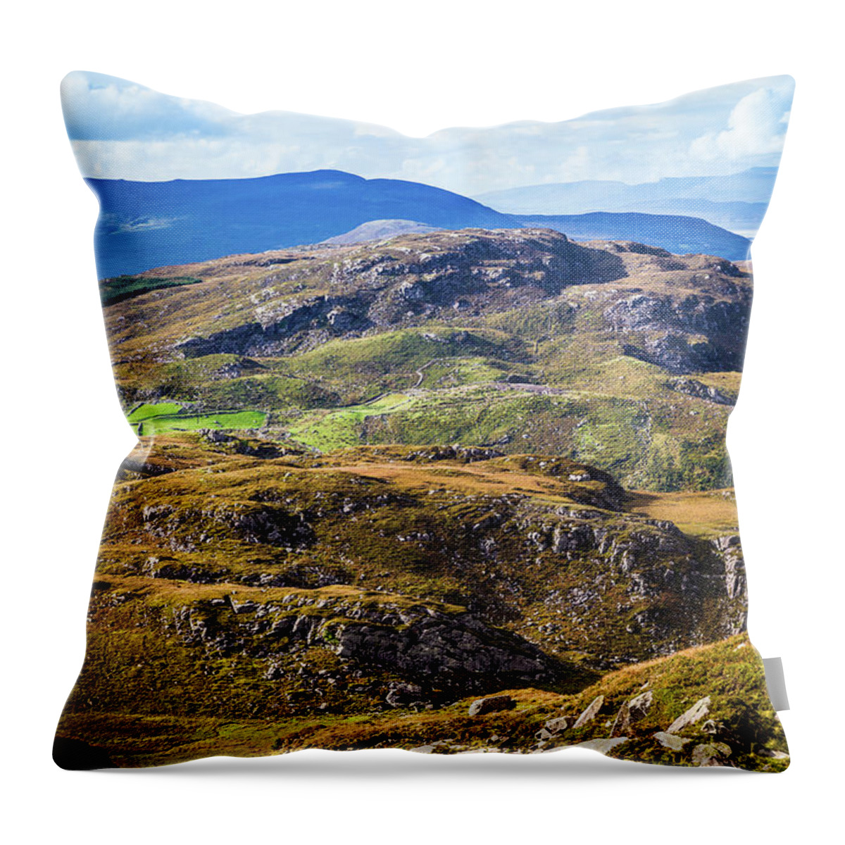 Blue Throw Pillow featuring the photograph Undulating green, purple and yellow rocky landscape in Ireland by Semmick Photo