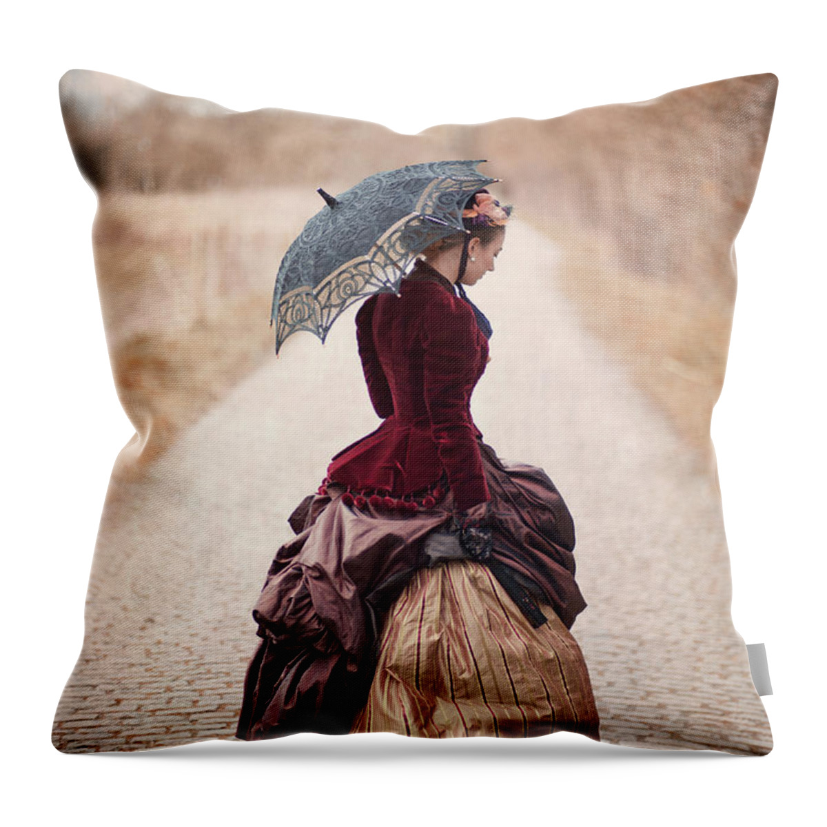 Victorian Throw Pillow featuring the photograph Victorian Woman Alone On A Cobbled Path by Lee Avison