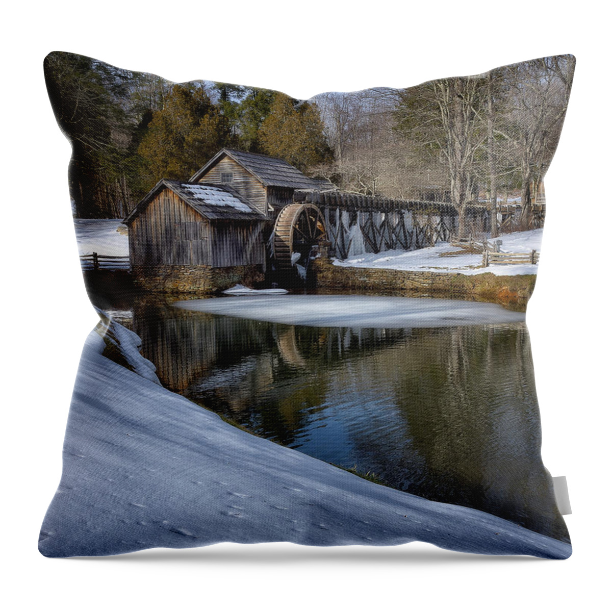 Mabry Mill Mabry Water Wheel Blue Ridge Parkway Virginia Blue Ridge Parkway Blue Ridge Fall Lake Pond Water Mill Grist Mill Water Wheel Blue Ridge Landscape Mabry Mill Landscape Mountains Wildlife Trees Color Leaves Turning Americana Scene River Stream Creek Reflection Wood Texture Grain Stone Flour Oak Beauty Serenity Serene Peaceful Peace Roanoke Woolwine Hospital Art Snow Throw Pillow featuring the photograph Winter snow at Mabry Mill by Steve Hurt