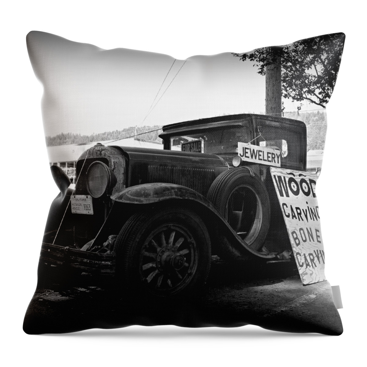 Creepy 1929 Buick Parked Along The Avenue Of The Giants In Miranda Throw Pillow featuring the photograph Wood Carvings Bone Carvings by Steve Natale