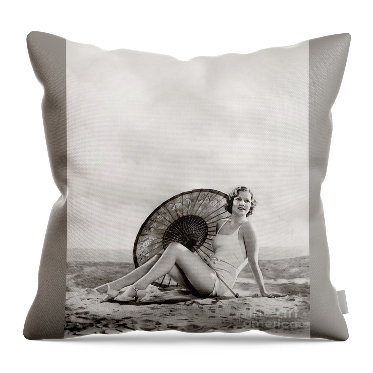 Ziegfeld Throw Pillow featuring the photograph Ziegfeld Model sun bathing on the beach by Alfred Cheney Johnston by Vintage Collectables