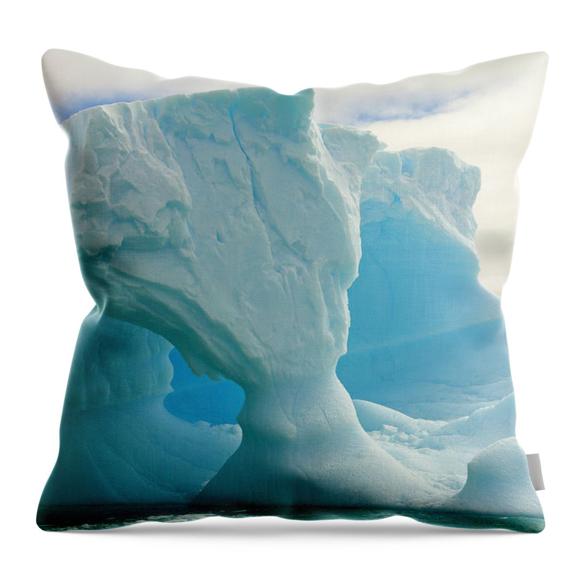 Scenics Throw Pillow featuring the photograph Iceberg With Arches, Antarctic Peninsula #1 by Eastcott Momatiuk