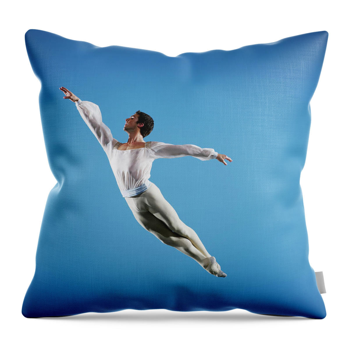 Ballet Dancer Throw Pillow featuring the photograph Male Ballet Dancer Leaping On Stage #1 by Thomas Barwick