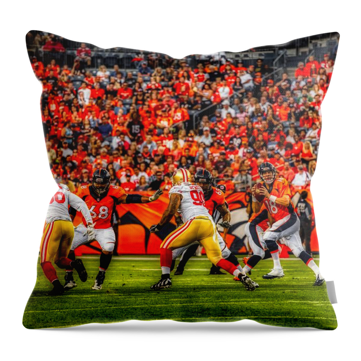 Peyton Manning Throw Pillow featuring the photograph Peyton Manning Dropping Back To Pass #1 by Mountain Dreams