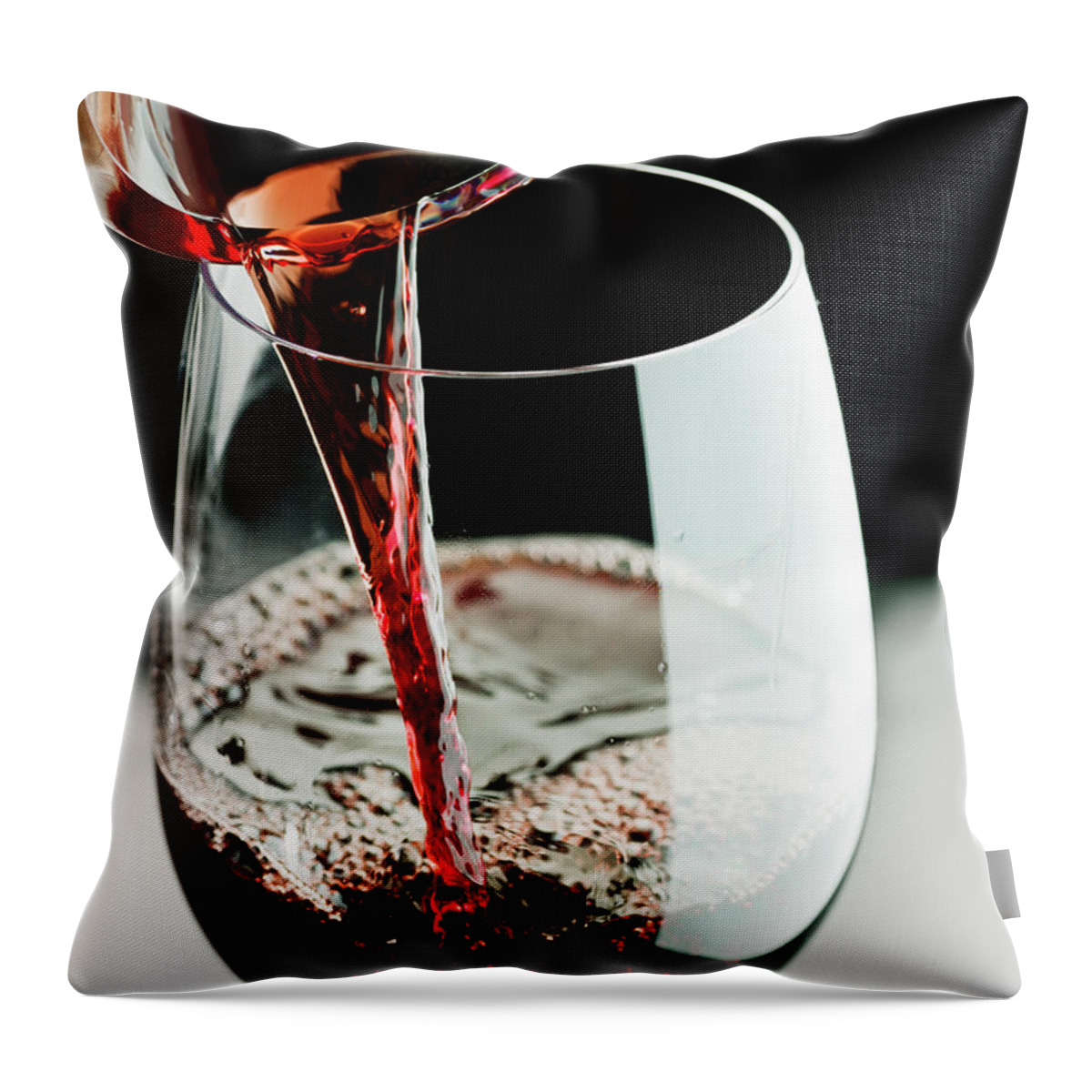Alcohol Throw Pillow featuring the photograph Red Wine Being Poured In A Glass #1 by Juanmonino