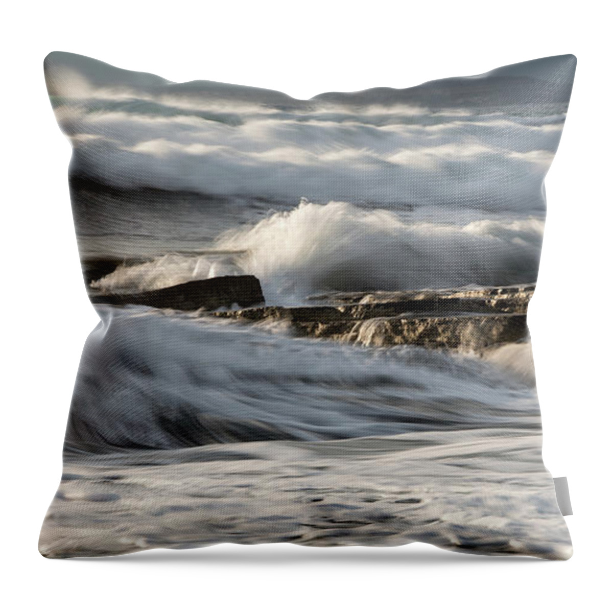Seascape Throw Pillow featuring the photograph Rocky seashore with wavy ocean and waves crashing on the rocks #5 by Michalakis Ppalis