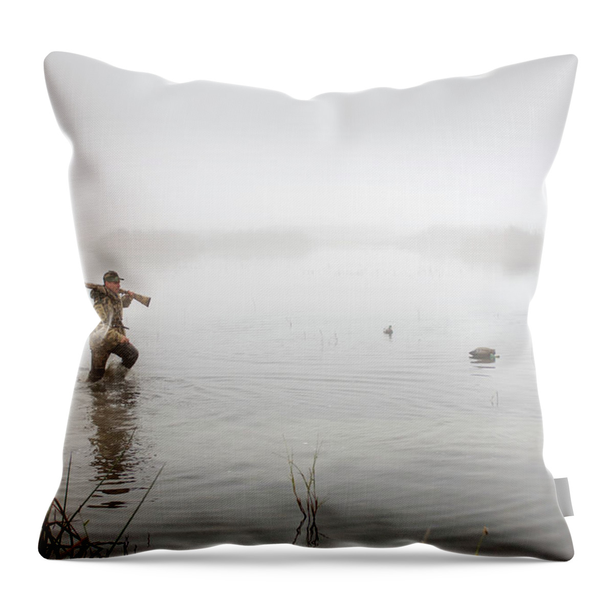 Tranquility Throw Pillow featuring the photograph A Hunter In The Water Wearing by Laura Ciapponi / Design Pics