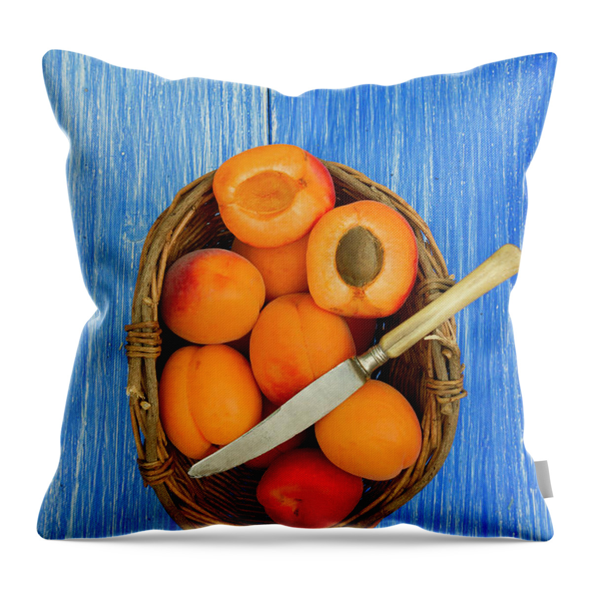 Apricot Throw Pillow featuring the photograph Apricots In Basket With Knife On Table by Westend61