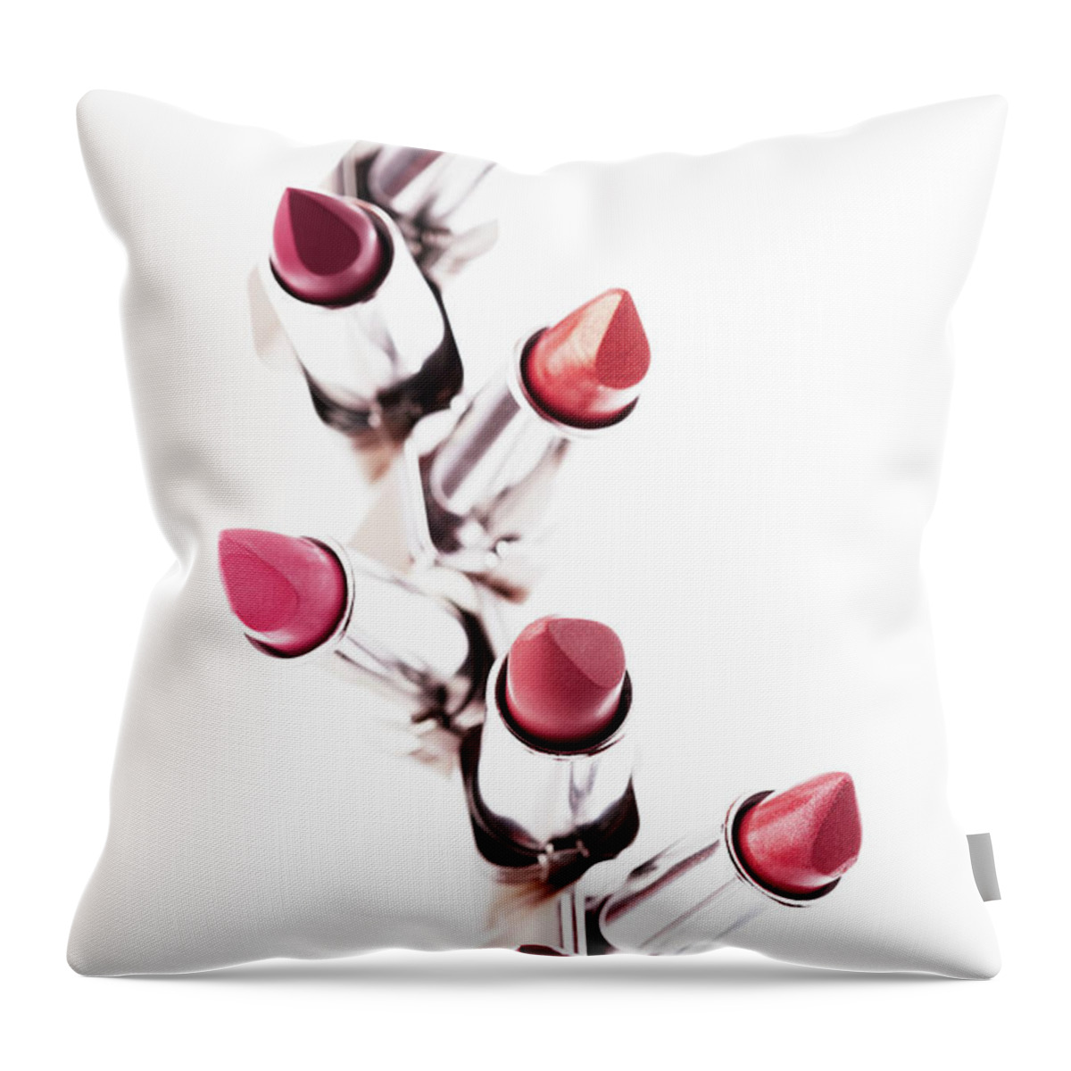 White Background Throw Pillow featuring the photograph Assortment Of Coloured Lipsticks by Martin Poole
