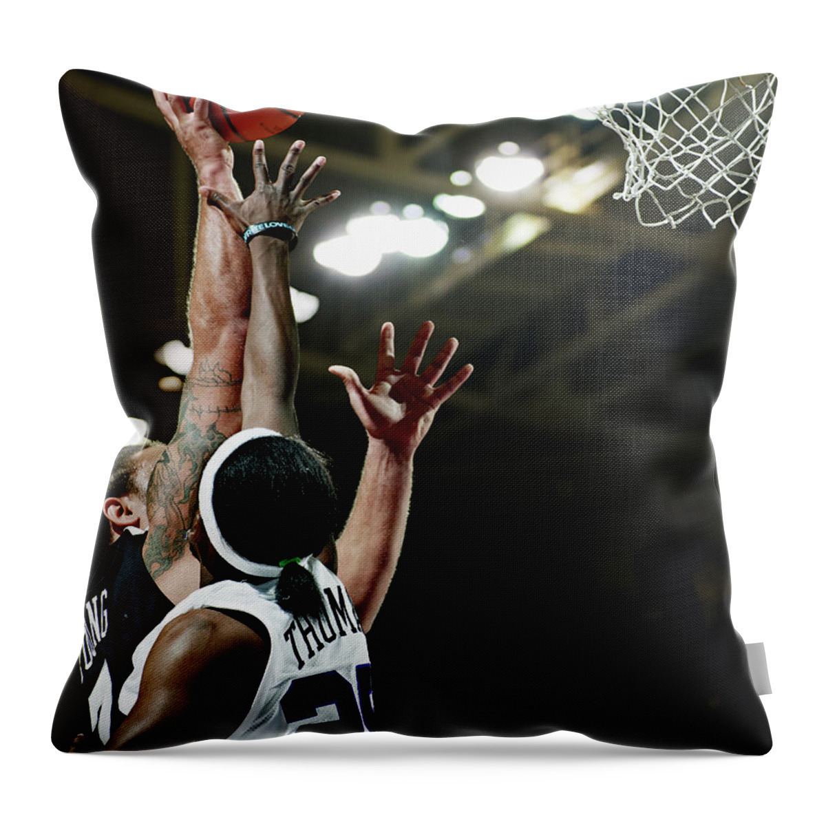 Young Men Throw Pillow featuring the photograph Basketball Player Dunking The Ball Over by Thomas Barwick