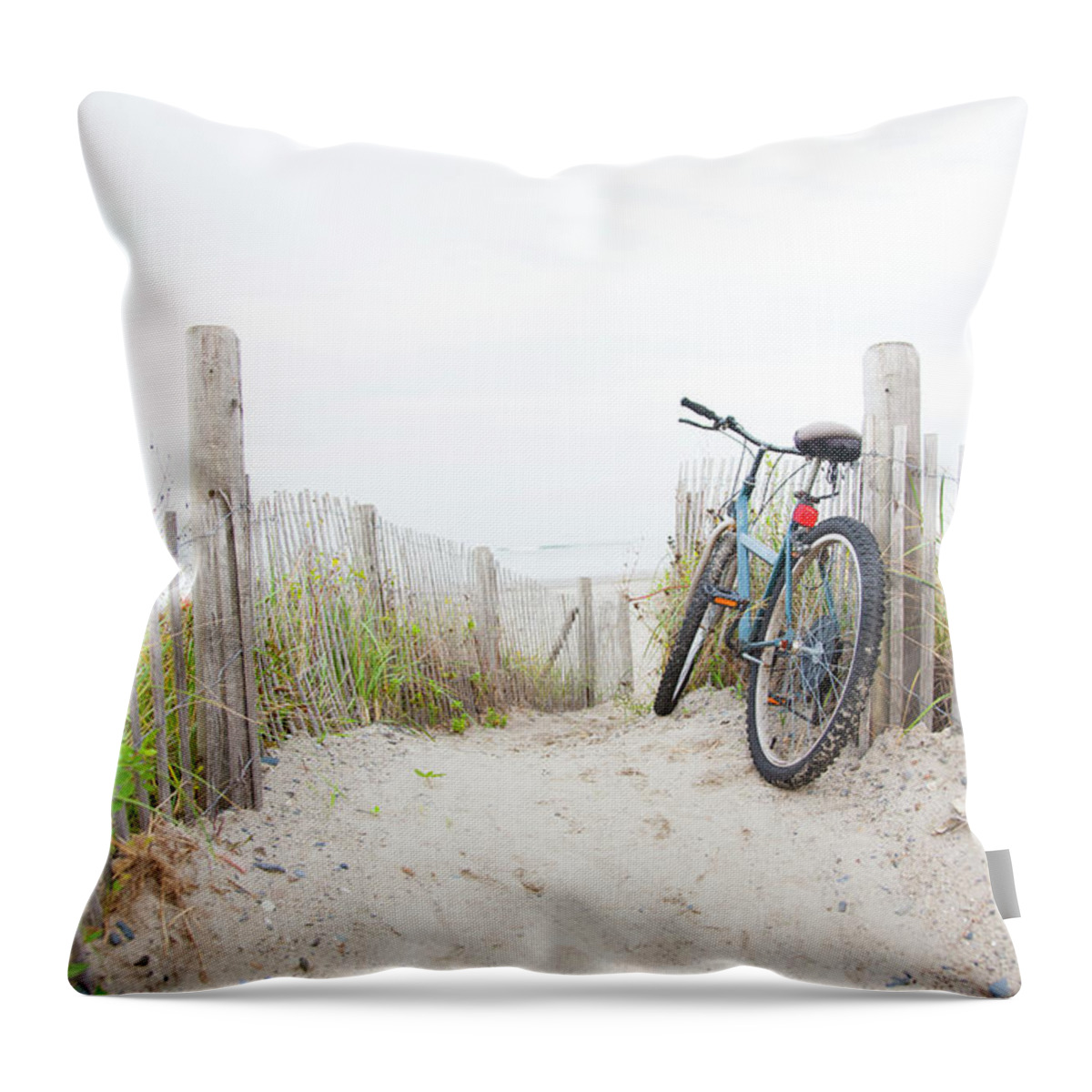 Grass Throw Pillow featuring the photograph Bicycle Leaning On Beach Fence by Jacqueline Veissid