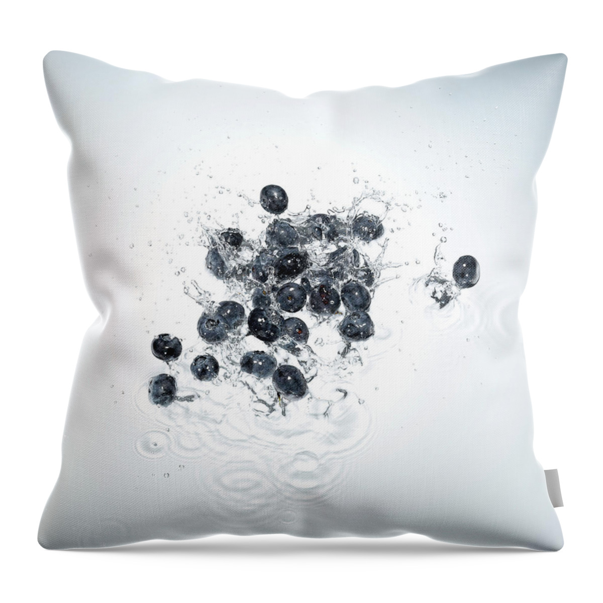 White Background Throw Pillow featuring the photograph Blueberries Splashing In To Water by Chris Stein