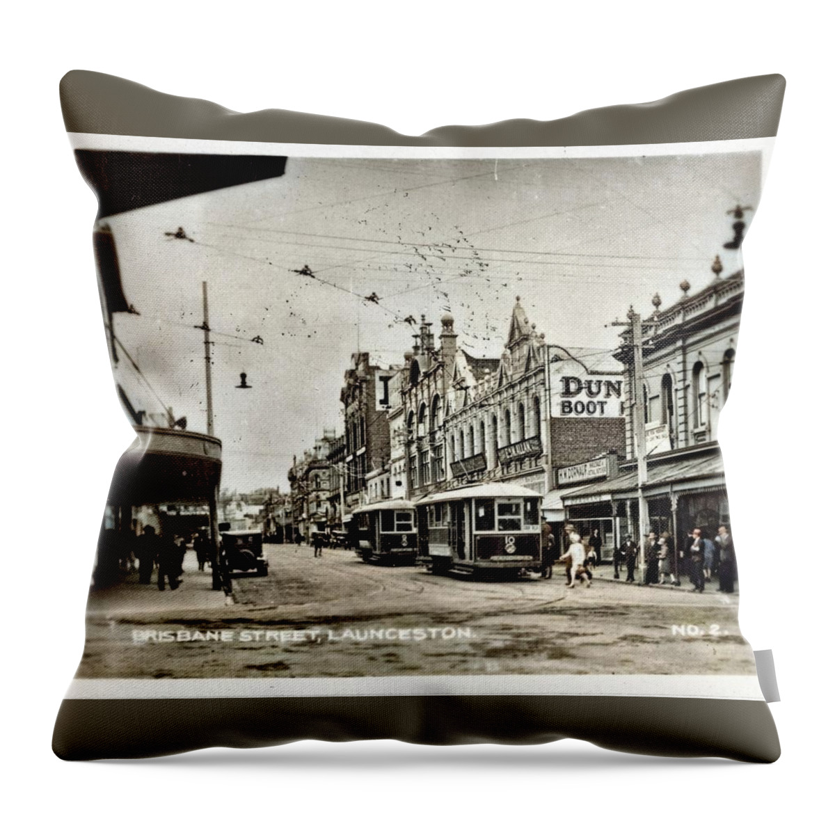 Colorized Throw Pillow featuring the painting Brisbane Street, Launceston and trams. c1930 colorized by Ahmet Asar by Celestial Images