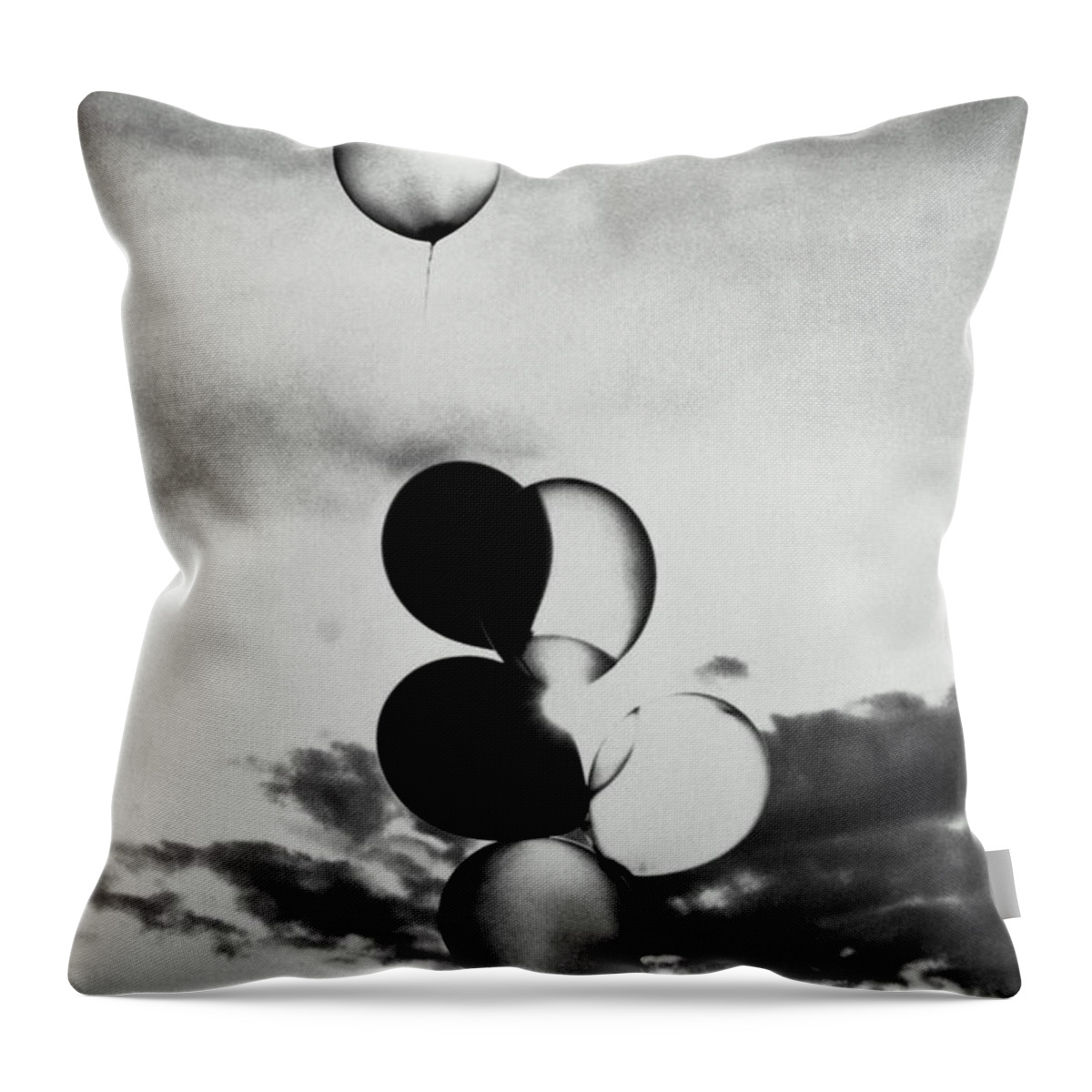 Mid-air Throw Pillow featuring the photograph Bunch Of Balloons In Sky, One Floating by Ross Anania
