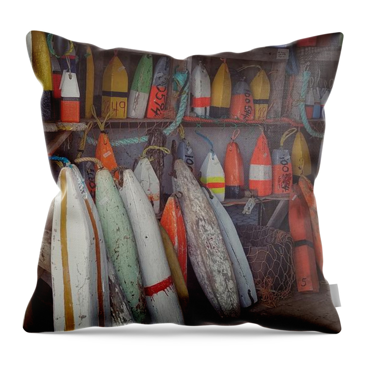 Buoys Throw Pillow featuring the photograph Buoys in a sea shack by Mary Capriole