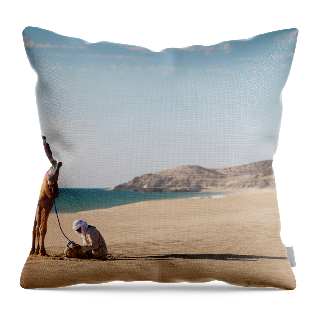 Mature Adult Throw Pillow featuring the photograph Camel And Guide Sit On White Sandy by Justin Lewis