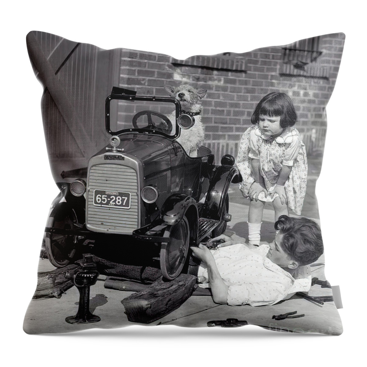Vintage Throw Pillow featuring the photograph Children And Dog Repairing 1920s Pedal Car by Retrographs