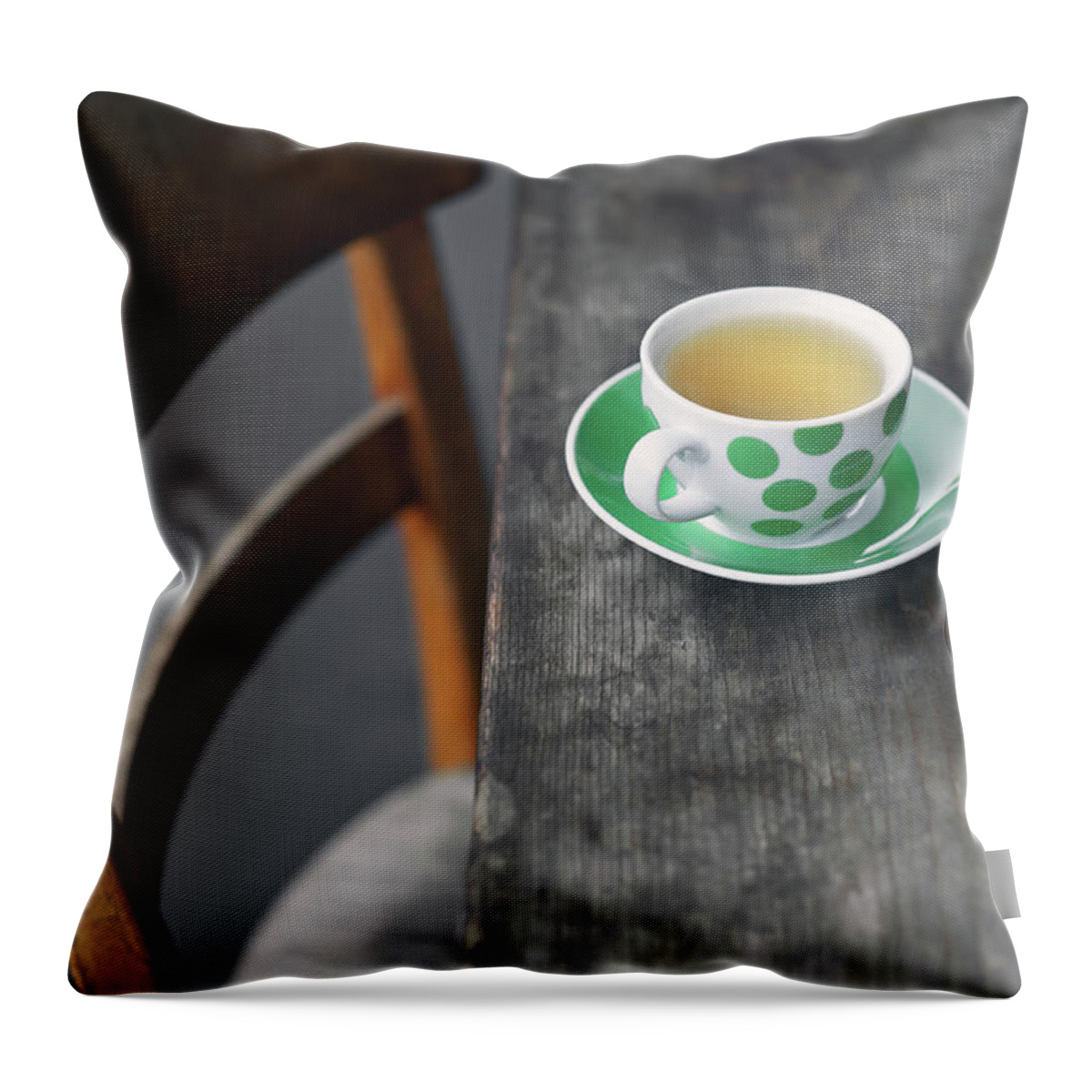 Gstaad Throw Pillow featuring the photograph Cup Of Tea On Wooden Table by A.y. Photography