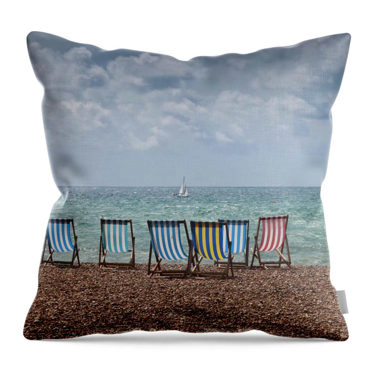 Outdoors Throw Pillow featuring the photograph Deck Chairs And Yacht by Darren Lehane