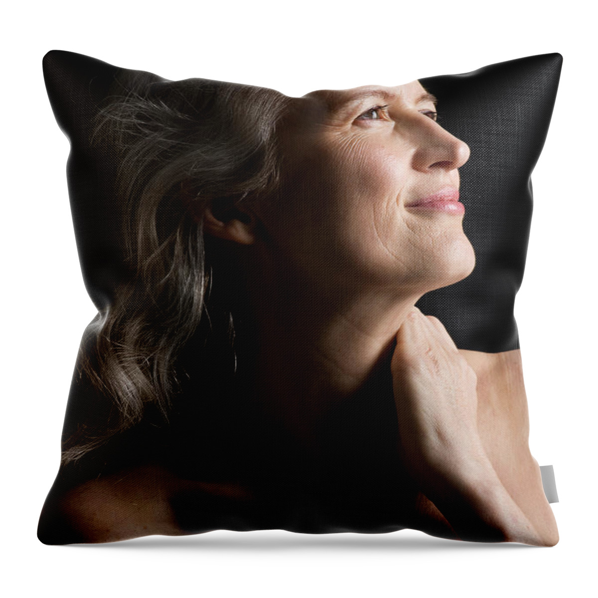 Mature Adult Throw Pillow featuring the photograph Dramatic Portrait Of Mid-aged Woman by Leland Bobbe