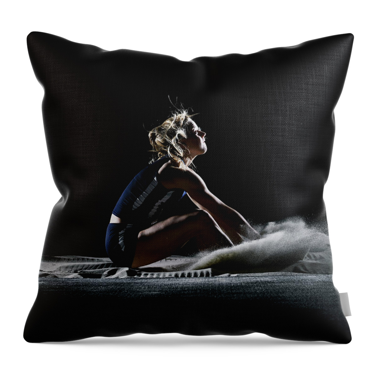 Three Quarter Length Throw Pillow featuring the photograph Female Athlete Landing In Long Jump by Thomas Barwick