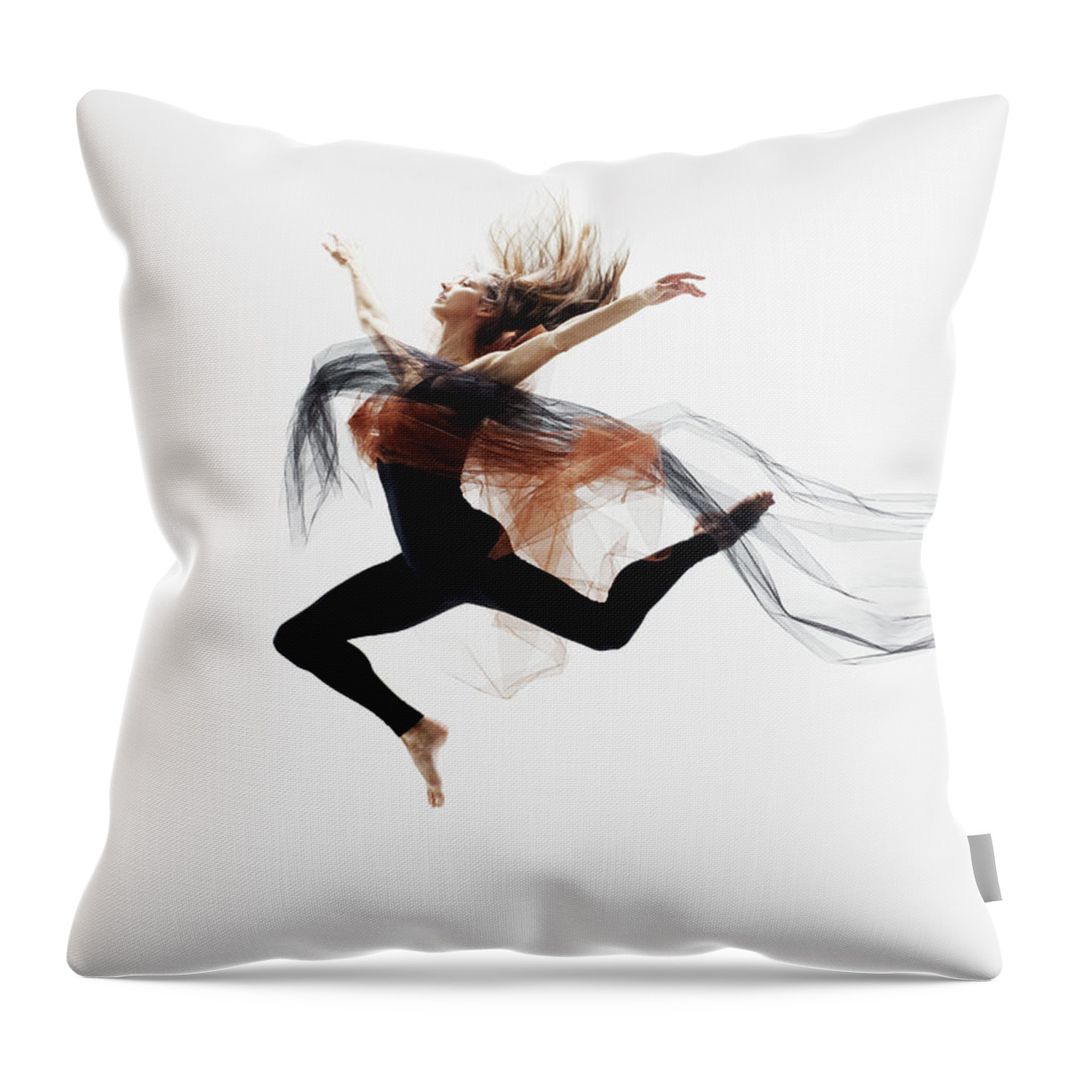 Human Arm Throw Pillow featuring the photograph Female Dancer Leaping In Mid Air by Thomas Barwick