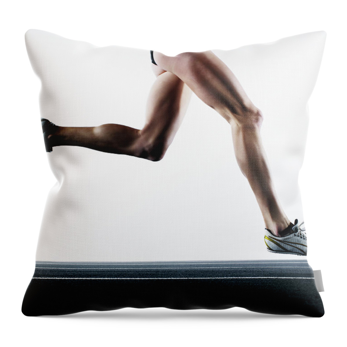 Shadow Throw Pillow featuring the photograph Female Runner On Track, Low Section by Thomas Barwick