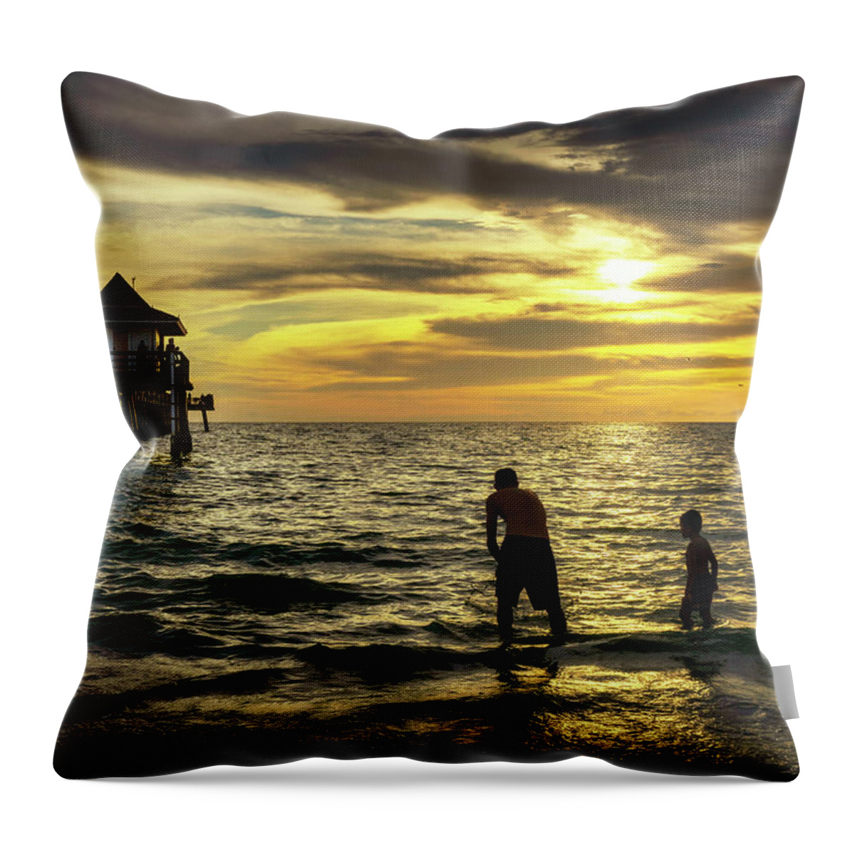 Estock Throw Pillow featuring the digital art Florida, Naples, Fishing Pier, Playing On The Beach by Gabriel Jaime Jimenez