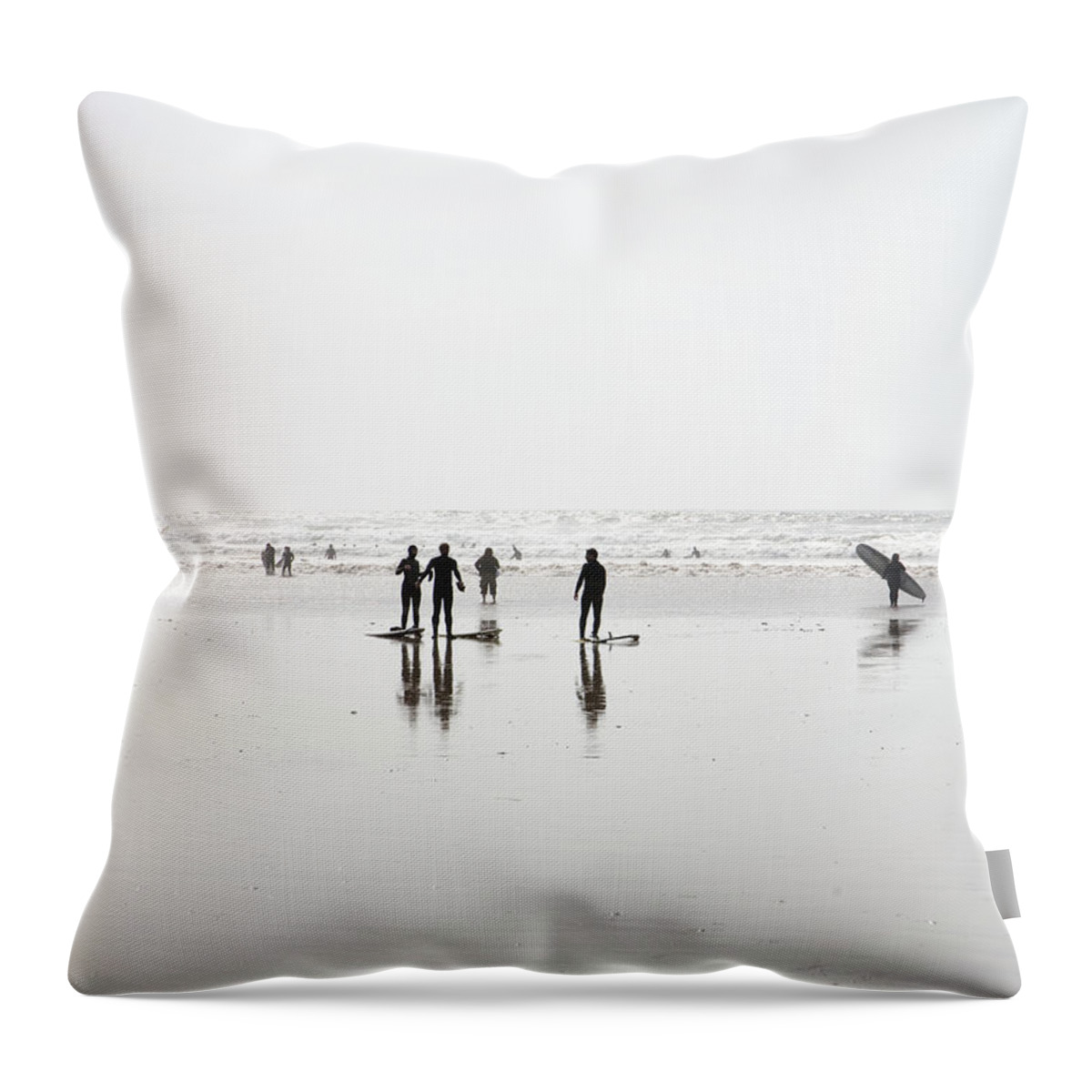 Part Of A Series Throw Pillow featuring the photograph Group Of Surfers Walking On Beach by Ashley Jouhar