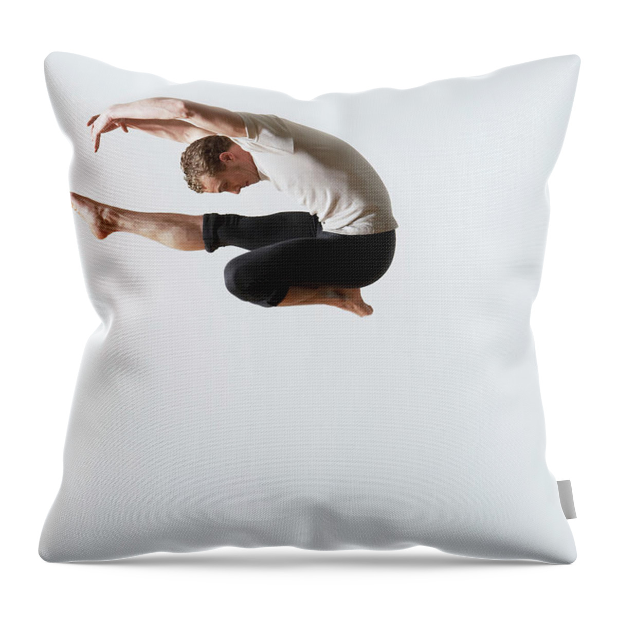 Ballet Dancer Throw Pillow featuring the photograph Leaping Ballet Dancer In Mid-air by Moodboard