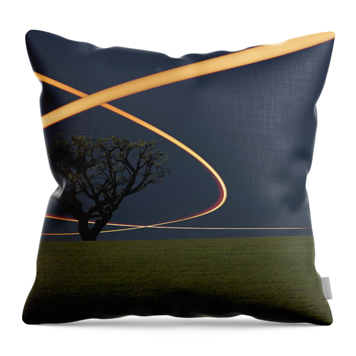 Scenics Throw Pillow featuring the photograph Light Trails Around Tree by Paul Taylor