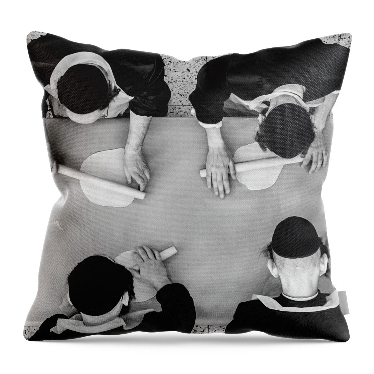 Working Throw Pillow featuring the photograph Making Matza by Guy Prives