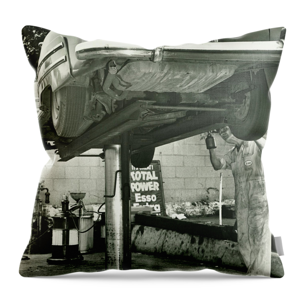 One Man Only Throw Pillow featuring the photograph Man Repairing Uplifted Car, B&w, Low by George Marks