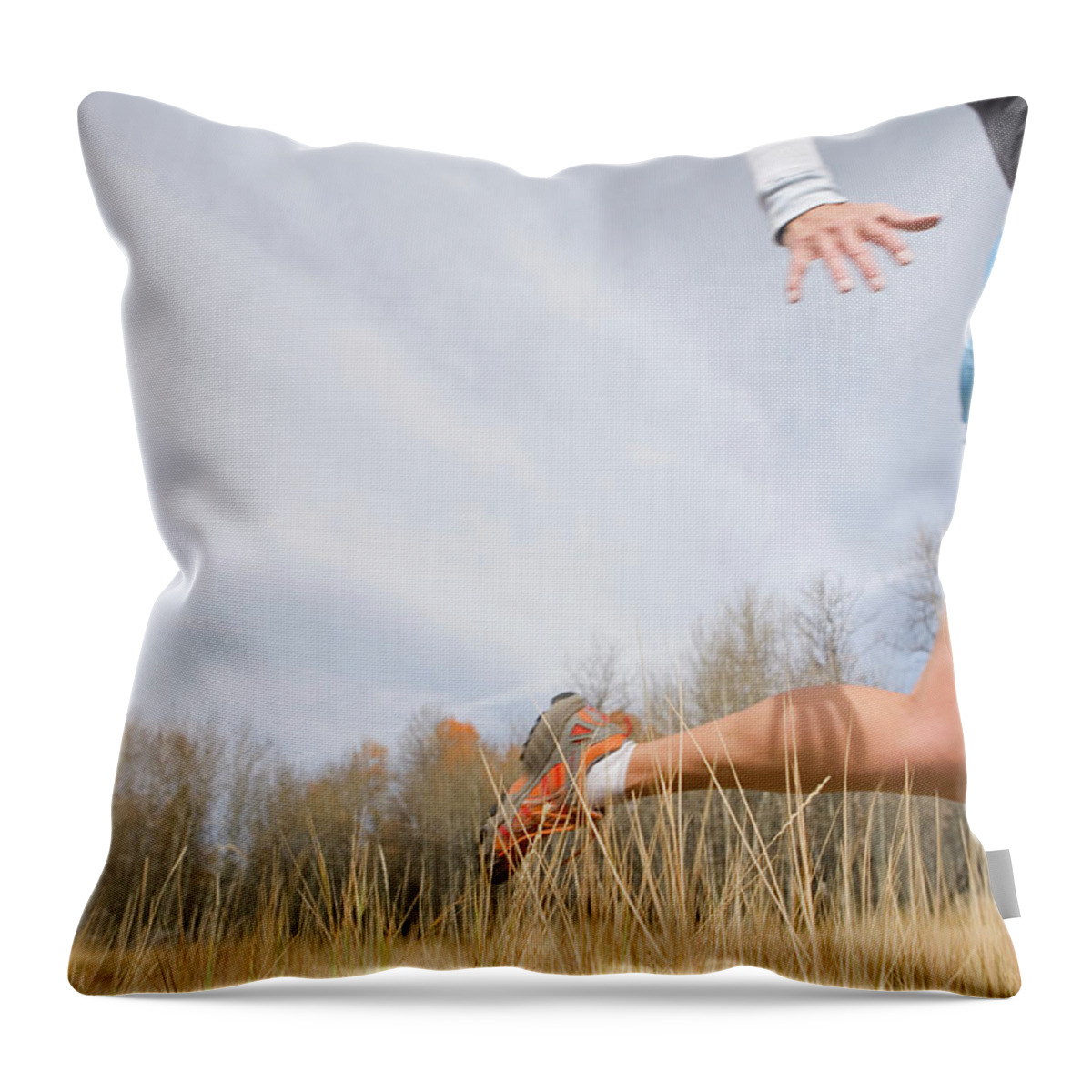Grass Family Throw Pillow featuring the photograph Mature Woman Running Through Tall by Caroline Woodham