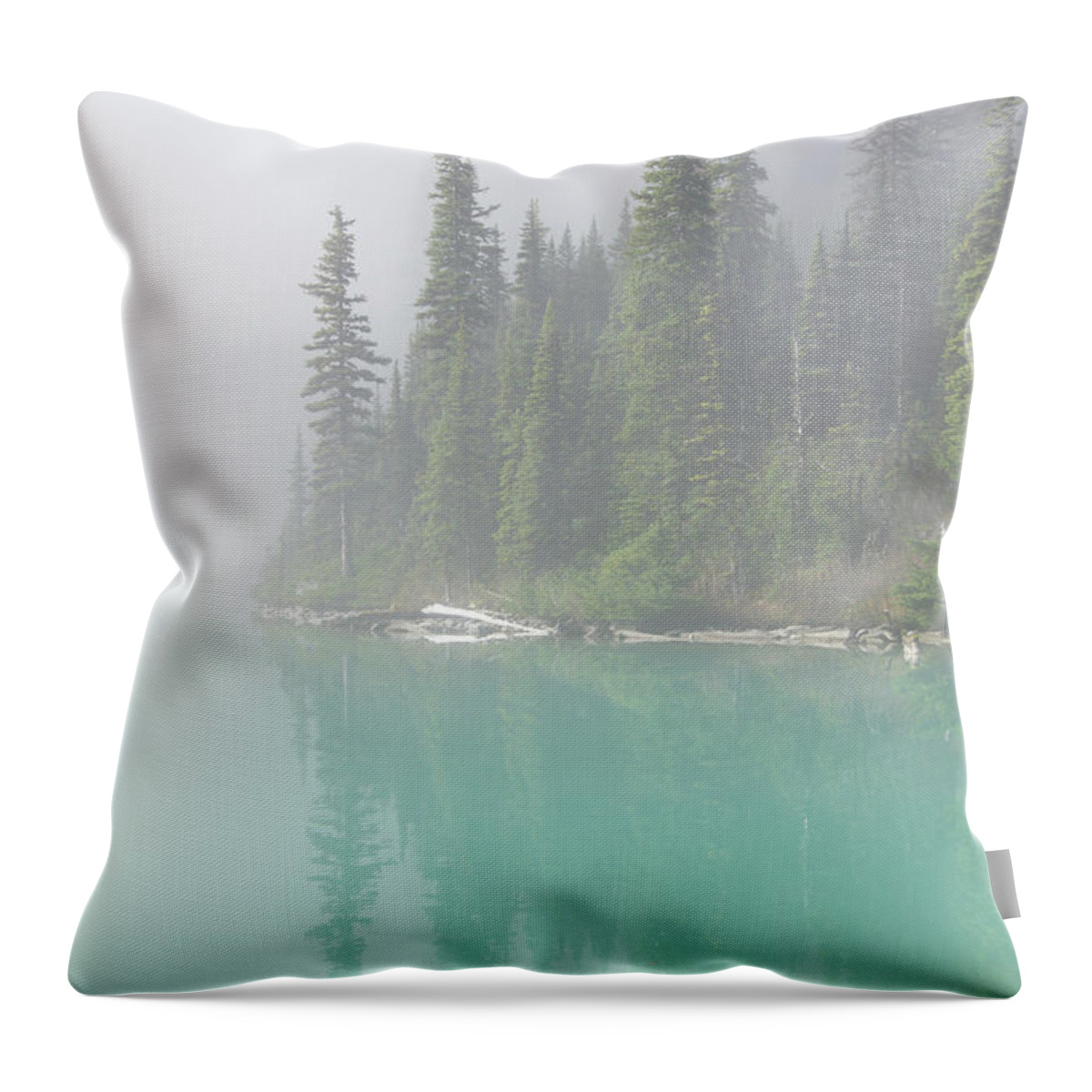 British Throw Pillow featuring the photograph Morning mist rising from turquoise lake by Steve Estvanik