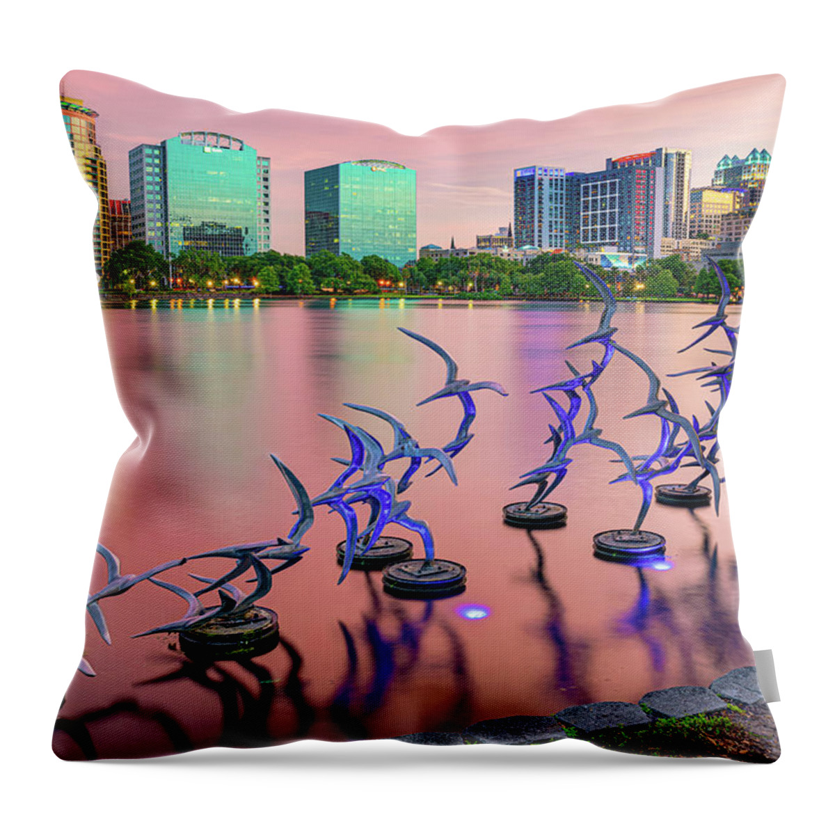America Throw Pillow featuring the photograph Orlando Skyline and Take Flight Sculptures at Sunset by Gregory Ballos